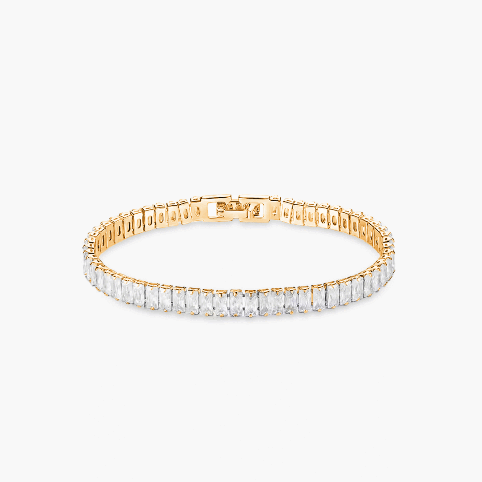 Emerald cut tennis bracelet featuring rectangular cubic zirconia stones in a silver-tone setting, displayed on a white background