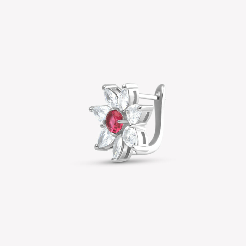 A flower-shaped stud earring with a red center and clear stone petals.